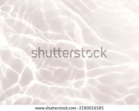 Reflection​ on​ surface​ blue​ water​ in​ the​ sea. Abstract​ of​ surface​ blue​ water​ for​ background. Closeup​ abstract​ of​ surface​ blue​ water. Splash​ed​ water​ in the​ swimming​pool. Abstract​