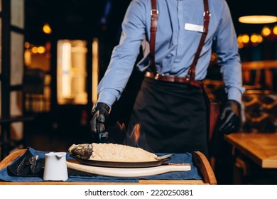 Sea Bass Baked In Sea Salt Crusted From Mediterranean. Cooking Food For Healthy Lunch Or Dinner.