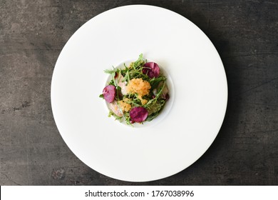 Sea Bass Carpaccio With Red Arugula. Selective Focus Point. Fine Dining Food Plating. Top View. 