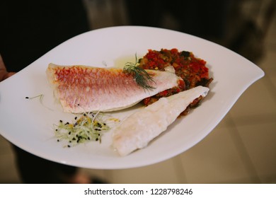 A Sea Bass With Vegatables Ratatouille Fish On The White Plate 