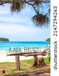 Sea beach with an inscription from the knots of trees Kata beach in Thailand on the island of Phuket. Travel and tourism.