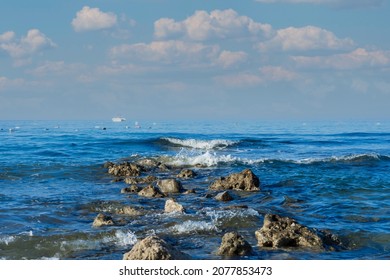 Sea ​​shore, Beach, Rocks And Small Waves. No People. Copy Space. Selective Focus.