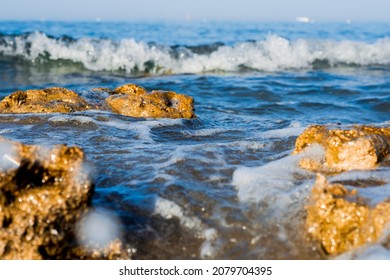 Sea ​​shore, Beach, Rocks And Small Waves. No People. Copy Space. Selective Focus.