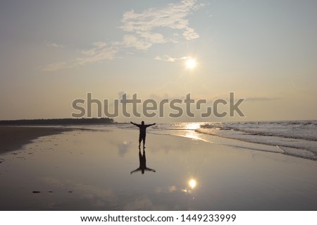 sea beach of sagar island, a man enjoying morning view of vast sea