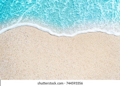 Sea Beach and Soft wave of blue ocean.  Summer day and sandy beach background
 - Powered by Shutterstock