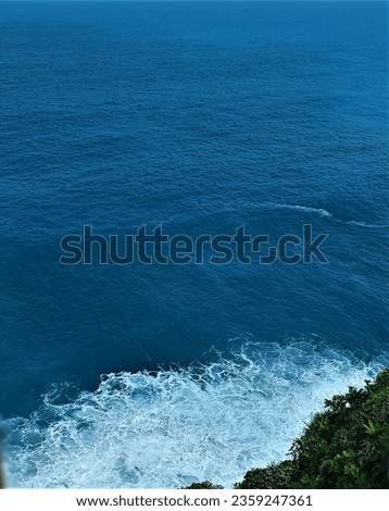 Similar – Sea waves breaking against cliff