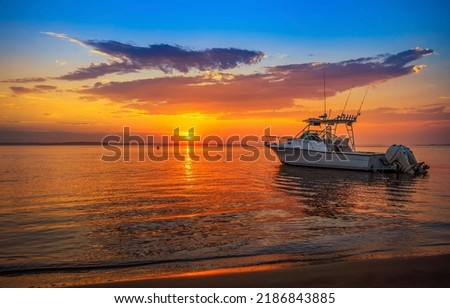 Sea boat at dawn landscape. Beautiful dawn over sea boat