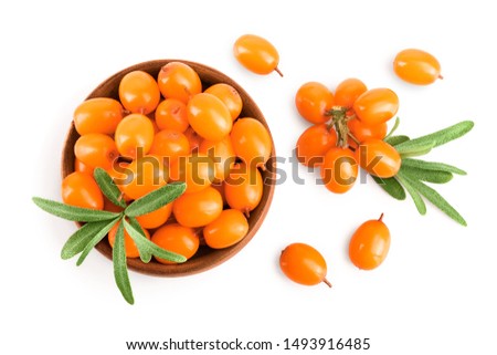 Sea buckthorn. Fresh ripe berry in woden bowl with leaves isolated on white background. Top view. Flat lay pattern