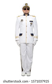 Sea captain in a white suit and sunglasses stands straight, isolated on a white background.