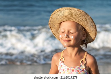 Sea Children Holiday. Sea Kids Portrait on Sea Background. Happy Child Tanning Sunbathing with Sunscreen on Face on Sea Coast. Children Sunscreen Care.