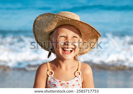 Sea Children Holiday. Sunscreen Sunblock Creme for Children. Happy Tanned Kid Girl with Sunscreen on Face Having Fun in Sea Background.