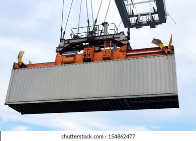 Sea Container Lifted By A Harbor Crane 