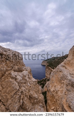 Sea and Dingli cliffs seen through a rocky window, Dingli, Malta
