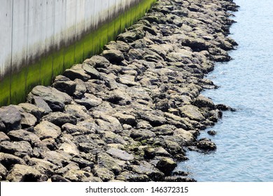 Sea Dock With Wall And Rocks