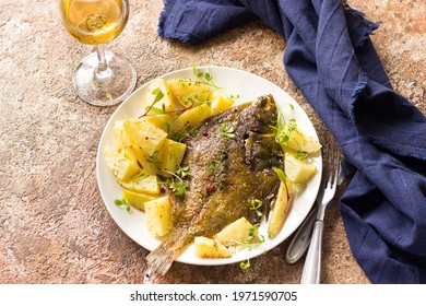 Sea Fish Flounder Cooked With Vegetables And Herbs. Served With White Wine. Healthy Food Concept