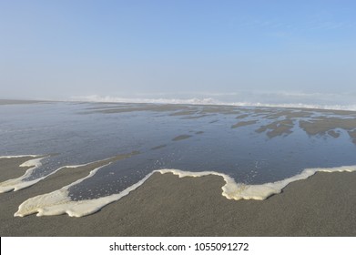 Sea Foam Rolling Onto Shore In California