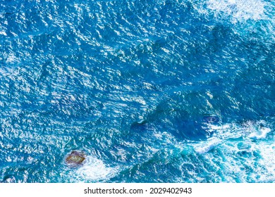 Sea foam waves from above. Turquoise water background from top view. Surface of the blue sea and ocean from the air. Travel concept and idea.  - Shutterstock ID 2029402943