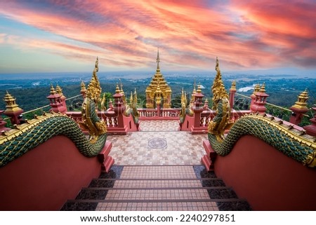 Sea of fog and sunrise sky at Wat Phra That Doi Phra Chan on the top hill of Doi Phra Chan mountain in Mae Tha, Lampang province, Thailand