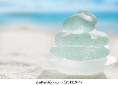 sea glass marbles  with white sand beach  seascape