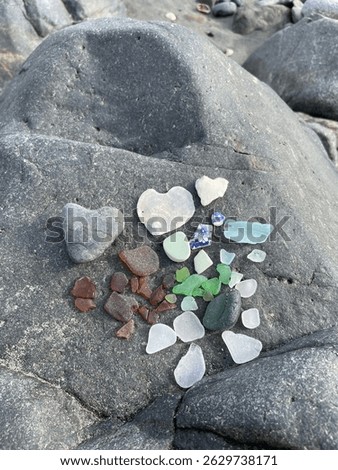 Sea glass pottery and heart rocks at the beach