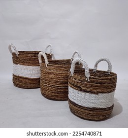 Sea grass Bead Baskets featuring decorative, natural colour beads around the rim. Handwoven from sustainably farmed sea grass.  Great for storage or an ornamental piece around the home. - Shutterstock ID 2254740871