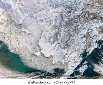 Sea Ice in the Bering Strait. A mosaic of sea ice shifted across the Bering Sea west of Alaska on February 5, 2008. Elements of this image furnished by NASA. - Powered by Shutterstock