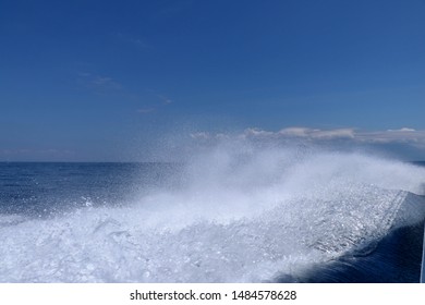 Sea And Kielwater Seen From Ship, Trail On The Water After The Ferry Sail, Wake Of Speed Boat. Wake Caused By Cruise Ship. Sea Water Foam Ship Track In The Ocean, Water Texture. 