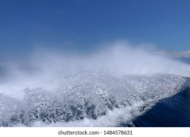 Sea And Kielwater Seen From Ship, Trail On The Water After The Ferry Sail, Wake Of Speed Boat. Wake Caused By Cruise Ship. Sea Water Foam Ship Track In The Ocean, Water Texture. 