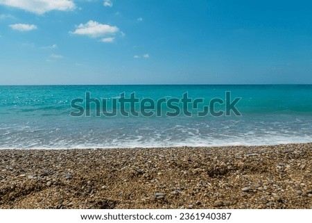 Sea landscape shore pebbles beach. Selective focus. Nature.