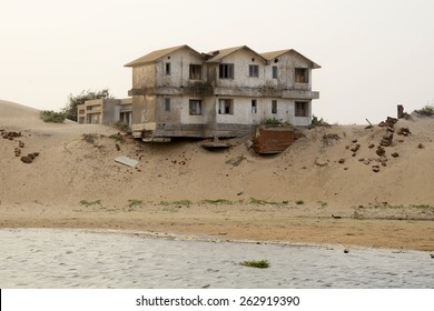 Sea Level Rising Causing Soil Erosion In The Costal Belt Which Cause Damage To Human And His Livelihood And Property, A House Is Hanging Dangerously On June 28, 2014 In Odisha, India