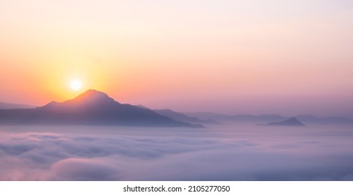 sea of ​​mist in the morning with sunrise. sea of fog over the mountain. Beautiful dramatic view. - Shutterstock ID 2105277050