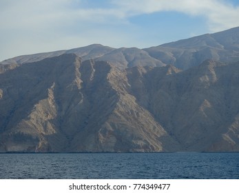 Sea of Oman and Hajar mountains