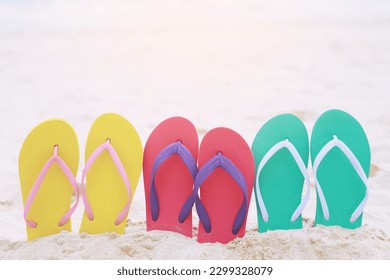 sea on the beach Footprint  people on the sand and slipper of feet in sandals shoes on beach sands background. travel holidays concept.