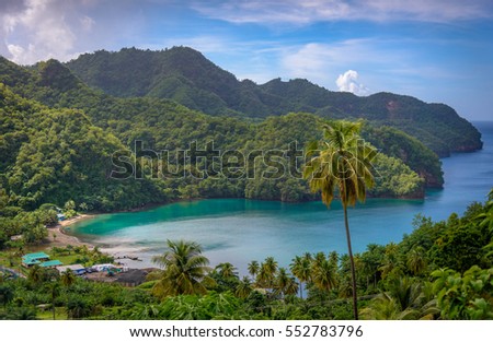Sea and palm trees in Saint Vincent and the Grenadines, beautiful exotic paradise with mountains and beautiful perfect beaches and colorful turquoise and emerald colored water