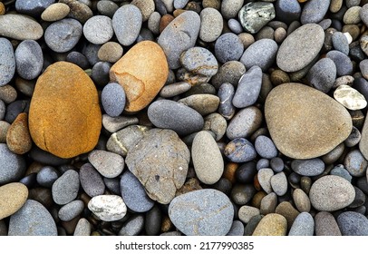 Sea pebbles on the beach. Sea pebbles background. Sea pebbles. Pebbles top view