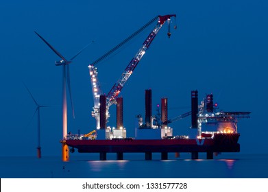 Sea Platform Ship That Uses Stilts To Elevate The Ship Above The Sea Water. This Vessel Is Used For Maritime Construction Of Sea Wind Turbines On The Sea Bed.