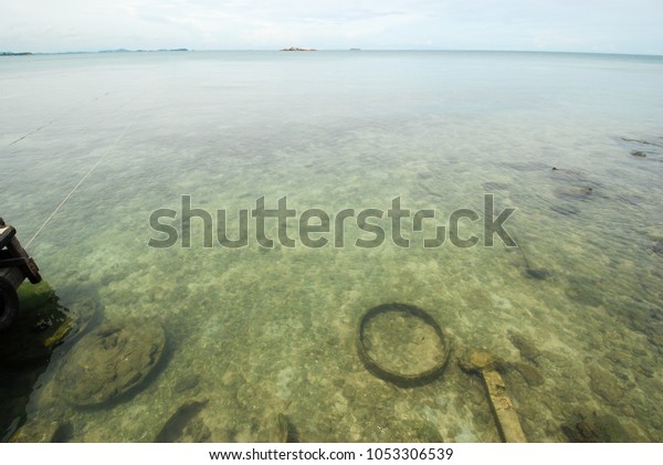 Sea pollution, old rubber tires\
and other garbage underwater at Samed island, Rayong,\
Thailand