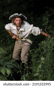 Sea Robber Ship Captain Armed Pirate Goes Through Jungle. Concept Historical Halloween. Filibuster Cosplay