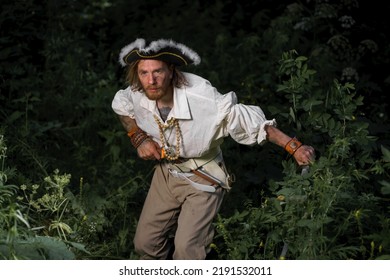 Sea Robber Ship Captain Armed Pirate Goes Through Jungle. Concept Historical Halloween. Filibuster Cosplay