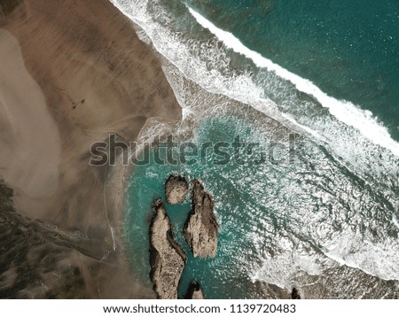 Similar – Aerial Drone View Of Dramatic Ocean Waves Crushing On Rocky Landscape