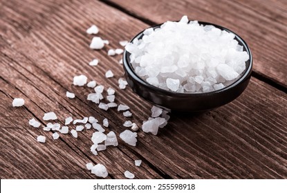 Sea Salt In Bowl On Wooden Background