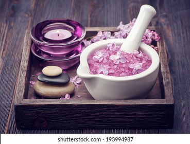 Sea salt in mortar, Zen massage stones and lilac flowers. Spa.  - Shutterstock ID 193994987