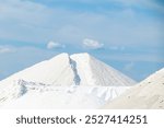 Sea salt piled up into a mountain of the salt production near the town of Aigues-Mortes in the Camarque region of France