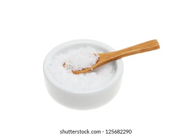 Sea Salt With A Wooden Spoon In A Ramekin Isolated Against White