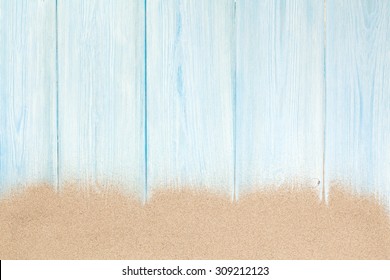 Sea Sand On Wooden Floor. Top View With Copy Space