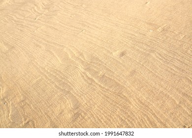 Sea Sand Patterns Made By The Wind, Shot In The Mid Day Sun. 