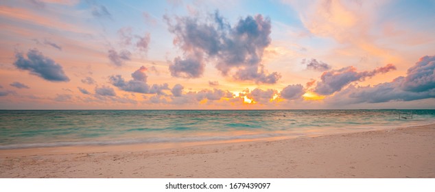 Sea sand sky concept, sunset colors clouds, horizon, horizontal background banner. Inspirational nature landscape, beautiful colors, wonderful scenery of tropical beach. Beach sunset, summer vacation - Shutterstock ID 1679439097