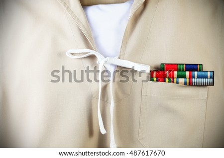 The sea scouts uniform in the scene appear the old navy emblem decoration badge put on the shirt pocket also represent the sea scouts uniform and cloth concept related background idea.