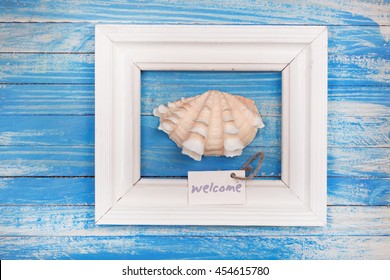 Sea Shell In The Frame With Sign - Welcome