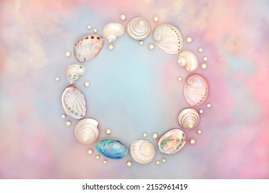 Sea Shell Wreath With Oyster Pearls On Rainbow Coloured Cloud And Sky Background. Ethereal Heavenly Nature Concept For Birthday, Birth Of Child, Anniversary Or Holiday Greetings Card. Top View.